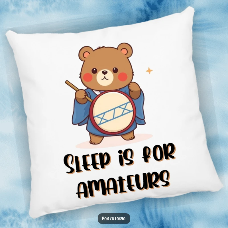 Funny cute bear in a blue kimono energetically playing a taiko drum, a soft and humorous pillow.