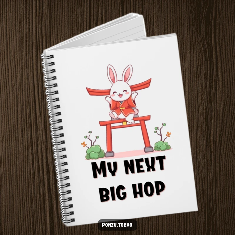 Funny bunny in a red kimono joyfully leaping over a stylized torii gate, a cute and funny notebook.