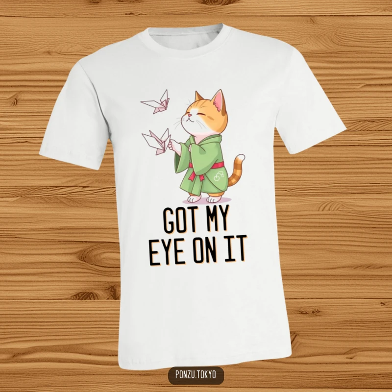 Funny cat in a green kimono playfully attempting to catch a floating origami crane, a purrfect funny gift.